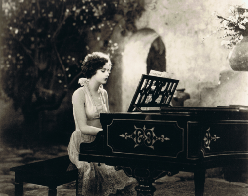 Greta Garbo plays piano